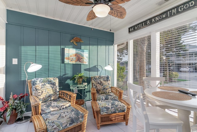 sunroom featuring a wealth of natural light and ceiling fan