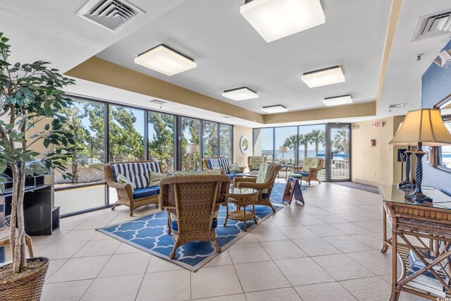 dining space featuring light tile patterned flooring and a wealth of natural light