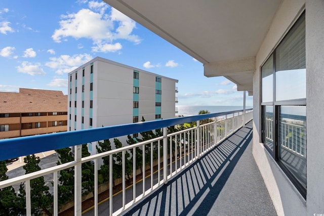 balcony featuring a water view