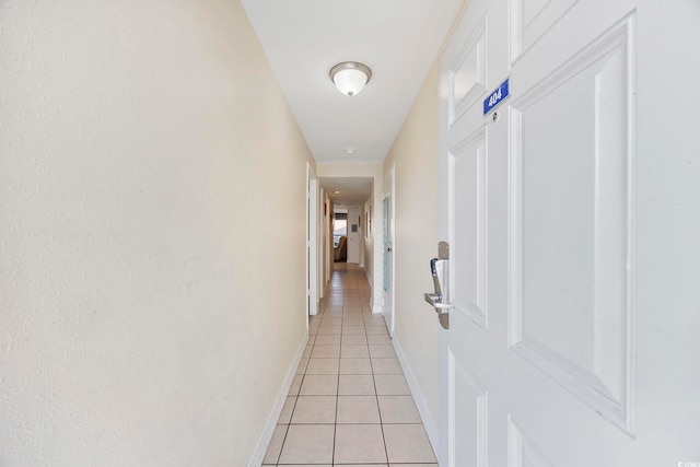 hallway featuring light tile patterned floors