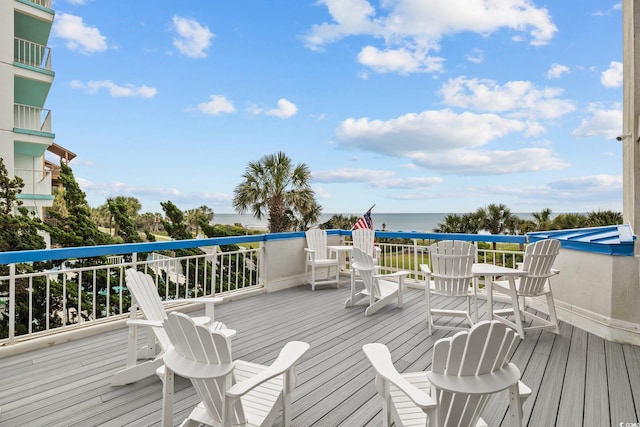 wooden deck with a water view