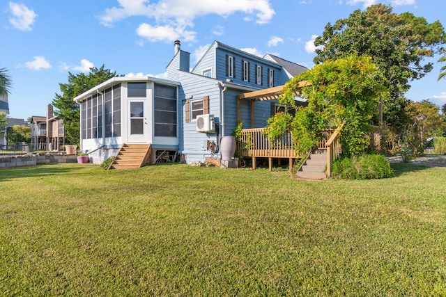 back of house featuring cooling unit and a lawn