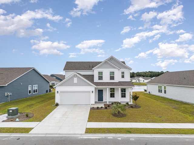 view of front of house with a garage and a front lawn