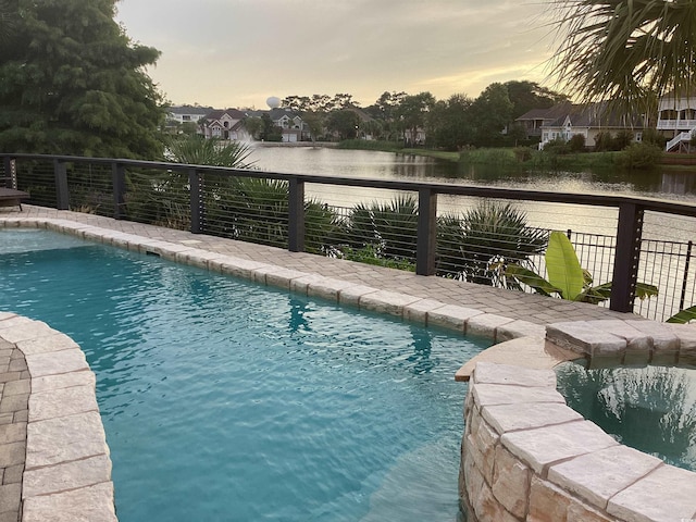 pool at dusk with a water view