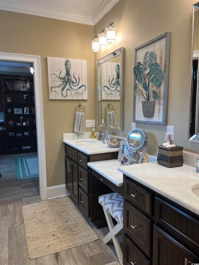 bathroom with vanity, hardwood / wood-style flooring, and ornamental molding