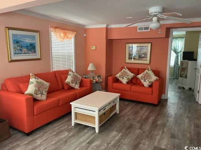 living room with crown molding, dark hardwood / wood-style floors, and ceiling fan