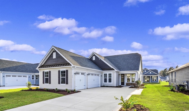 craftsman-style house featuring a garage, central air condition unit, and a front lawn