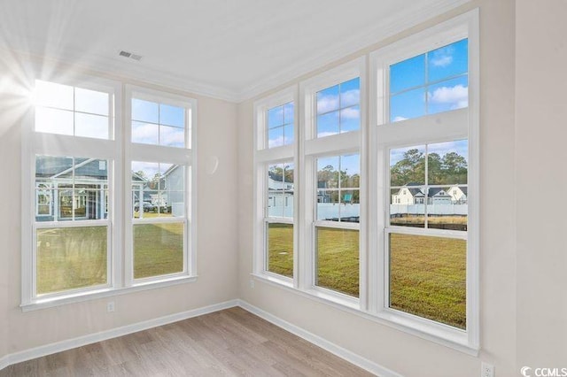 unfurnished sunroom with plenty of natural light