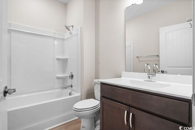 full bathroom featuring shower / bath combination, vanity, hardwood / wood-style flooring, and toilet