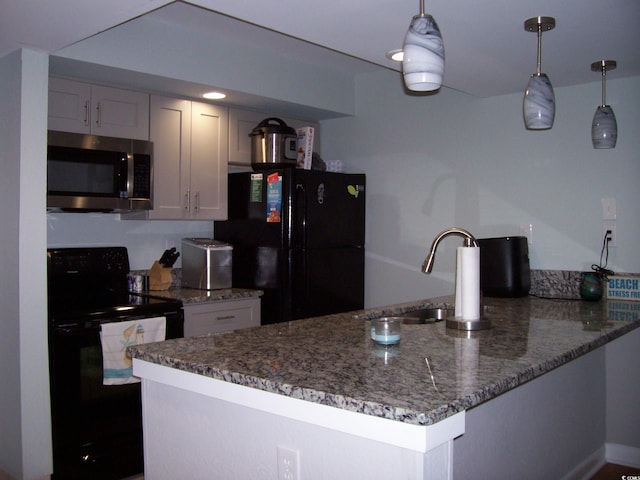 kitchen featuring black appliances, dark stone countertops, sink, pendant lighting, and kitchen peninsula