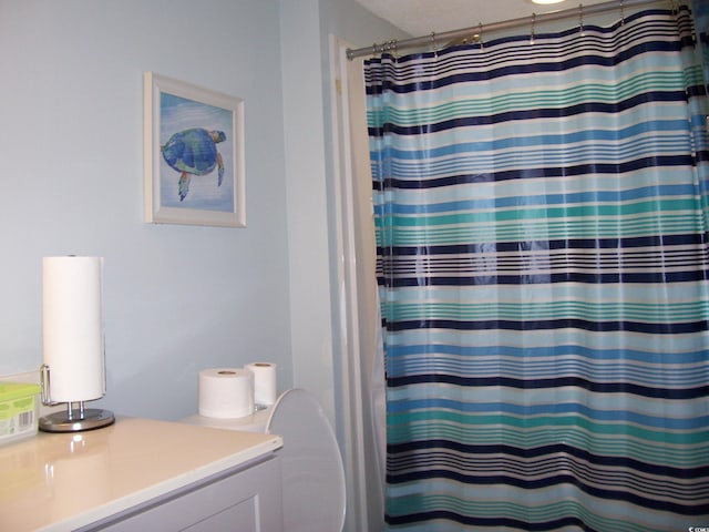 bathroom with vanity and a shower with curtain