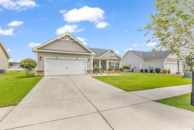 view of front of property with concrete driveway, a front yard, central AC unit, and an attached garage