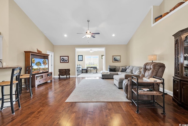 living room with high vaulted ceiling, baseboards, a ceiling fan, and dark wood finished floors
