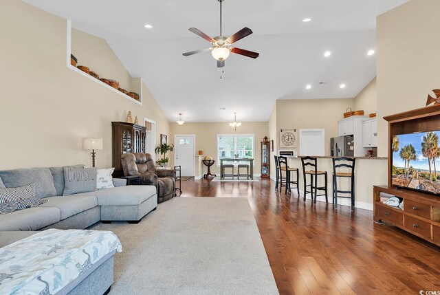 living room featuring high vaulted ceiling, recessed lighting, dark wood-type flooring, and a ceiling fan