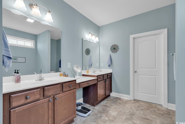 bathroom featuring baseboards and vanity