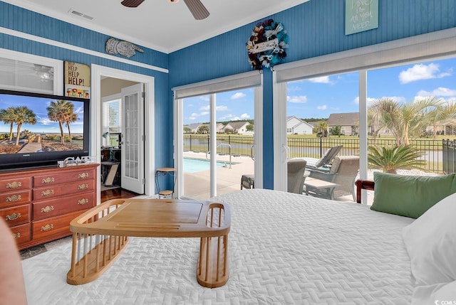 bedroom with crown molding, access to exterior, and visible vents