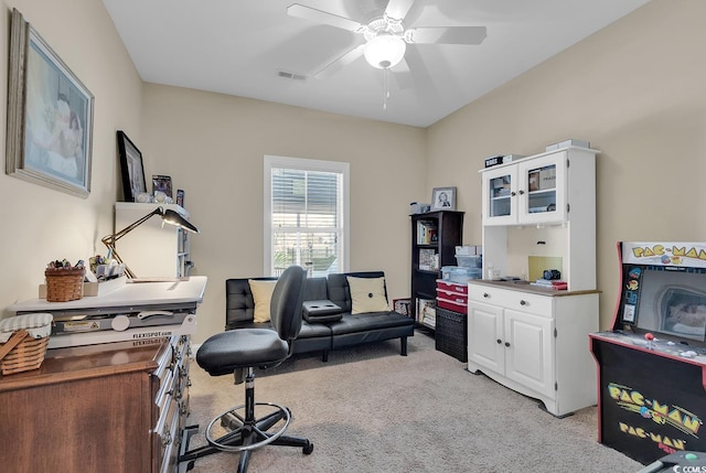 office with light carpet, a ceiling fan, and visible vents