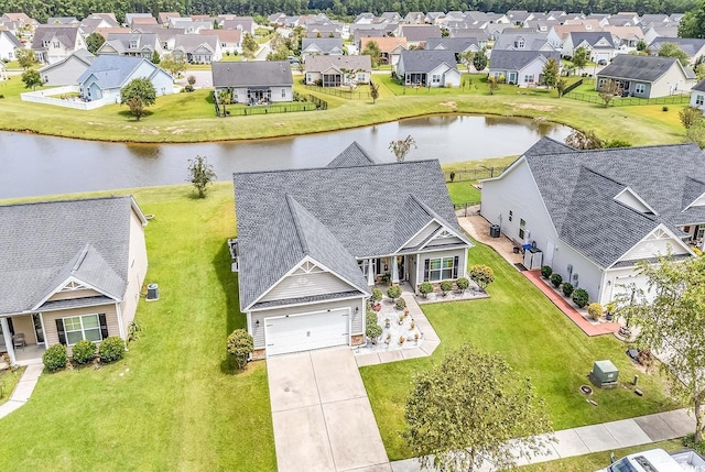 aerial view with a residential view and a water view