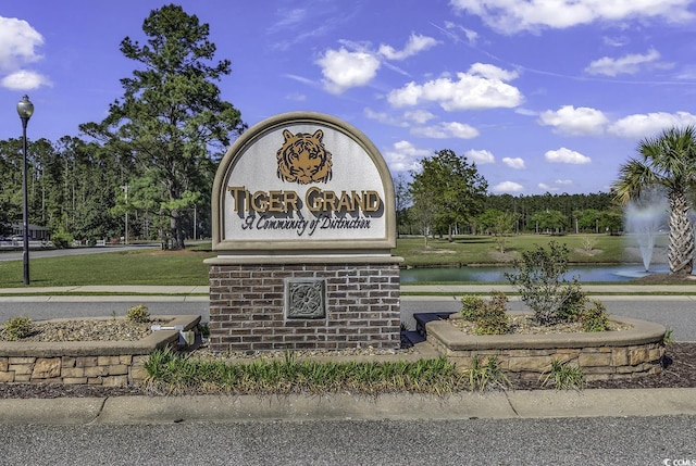 community sign with a water view