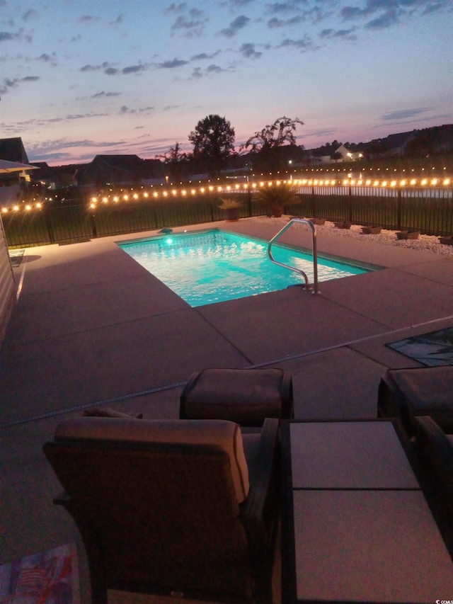 view of pool featuring a patio area, a fenced backyard, and a fenced in pool