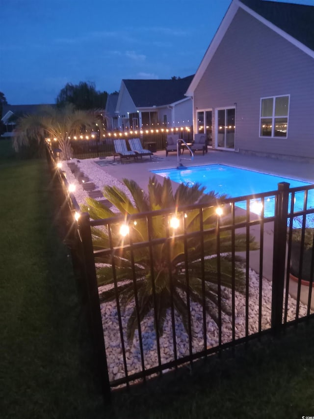 view of pool with a fenced in pool and a patio area