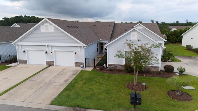 view of front facade featuring a garage and a front lawn