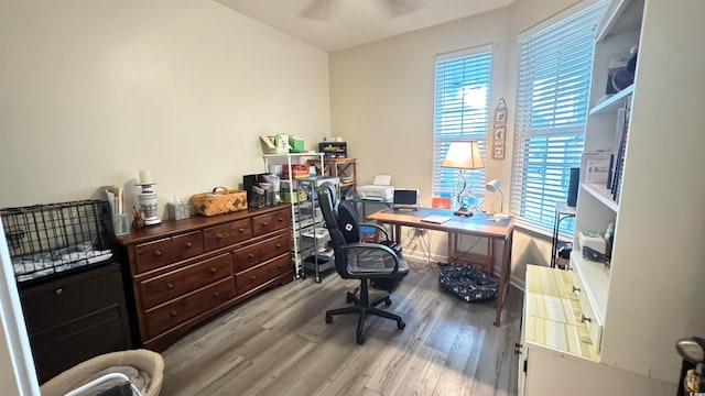 office area with light hardwood / wood-style floors