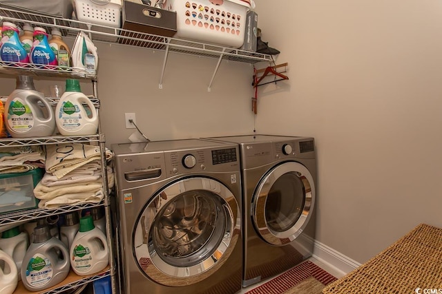 laundry room with independent washer and dryer