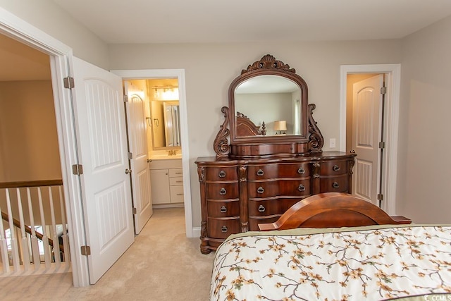 carpeted bedroom featuring ensuite bathroom