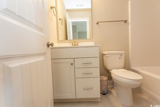 bathroom with tile patterned floors, vanity, and toilet