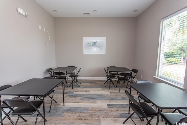 dining space with light hardwood / wood-style flooring