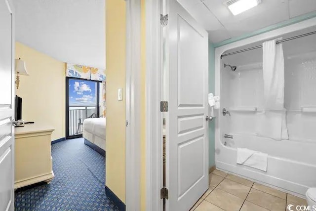 7100 Ocean Blvd N Unit 925, Myrtle Beach, SC 29572 - ensuite bathroom featuring shower / bath combo with shower curtain and tile patterned flooring