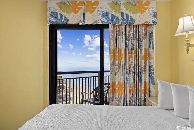 bedroom featuring a water view