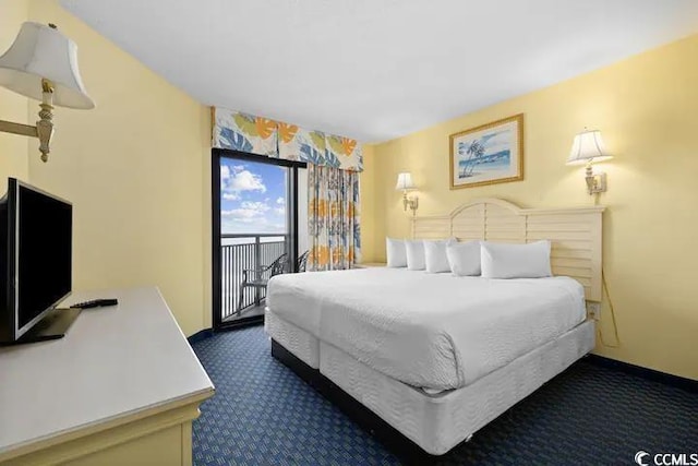 7100 Ocean Blvd N Unit 925, Myrtle Beach, SC 29572 - bedroom with dark colored carpet, access to outside, and baseboards