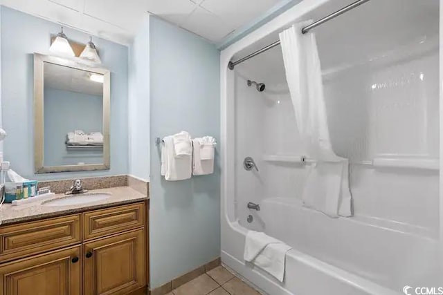 bathroom with tile patterned flooring, shower / tub combo with curtain, and vanity