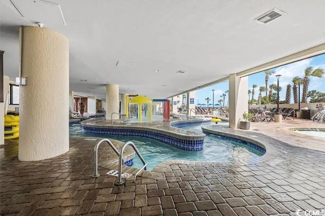 7100 Ocean Blvd N Unit 925, Myrtle Beach, SC 29572 - indoor pool featuring an in-ground hot tub and a patio