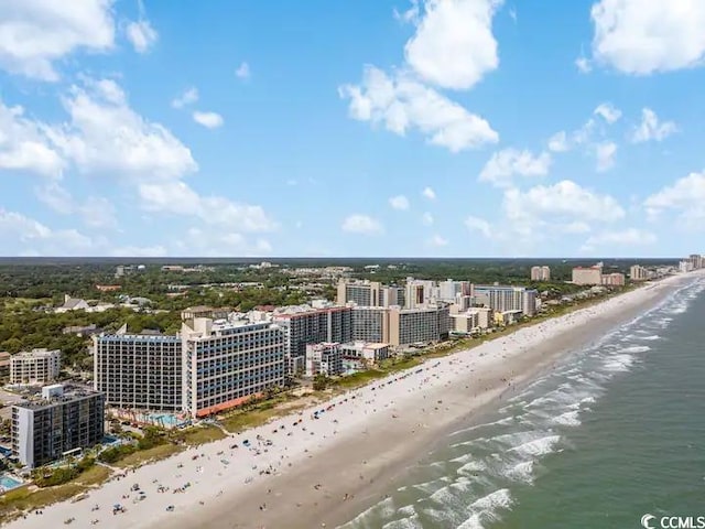 aerial view with a water view and a view of the beach