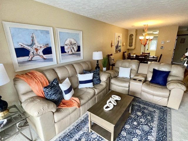 living area with a textured ceiling and a chandelier