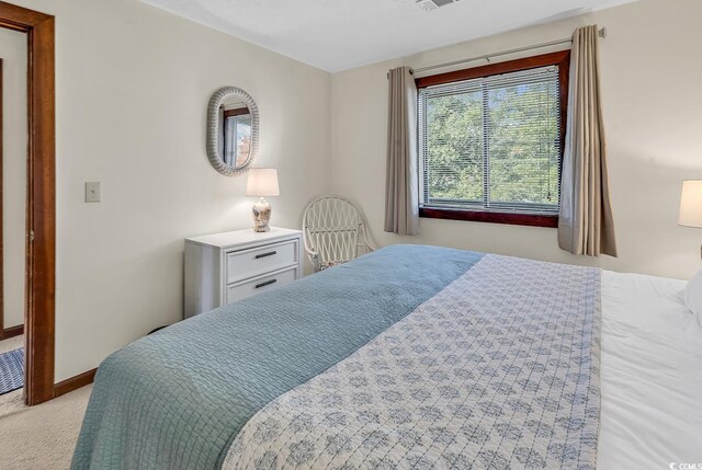 laundry area with stacked washer and clothes dryer