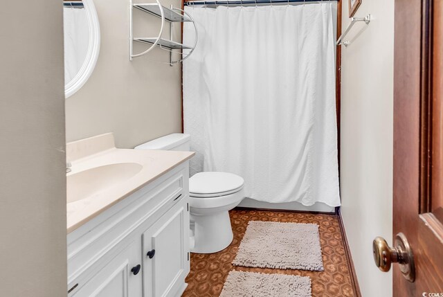 bathroom with vanity and toilet