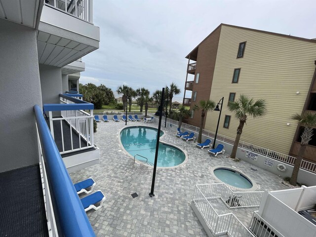 view of pool featuring a patio