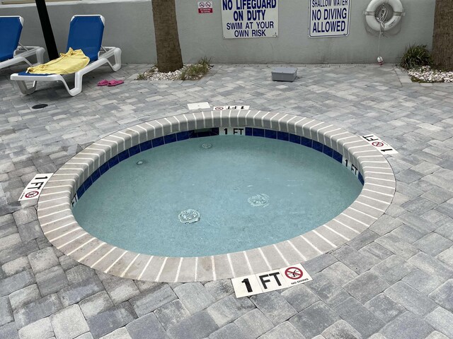 view of swimming pool featuring a patio area