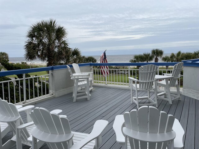 wooden terrace with a water view