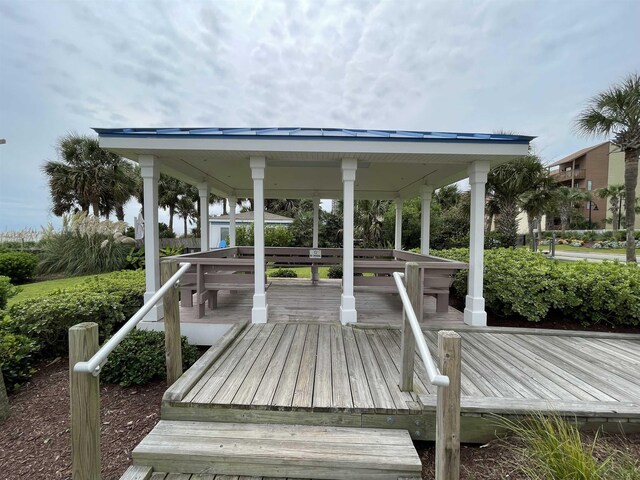 view of property's community featuring a wooden deck