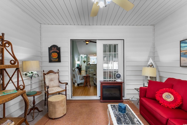 sitting room featuring ceiling fan and wood-type flooring