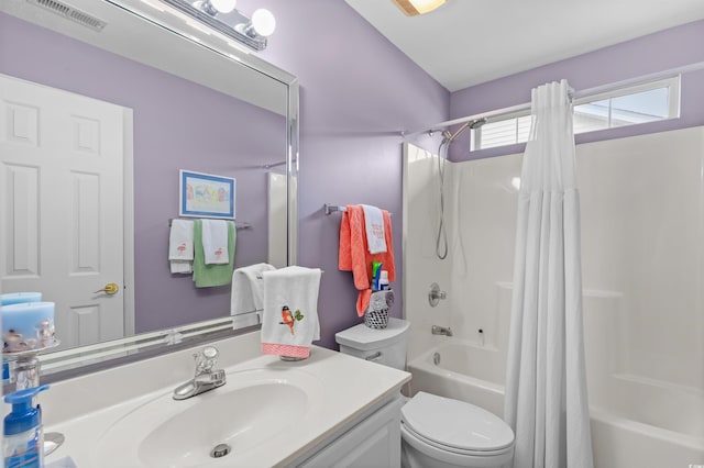 full bathroom featuring toilet, shower / tub combo with curtain, and vanity