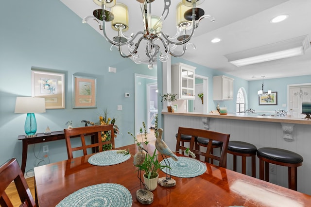 dining space with an inviting chandelier