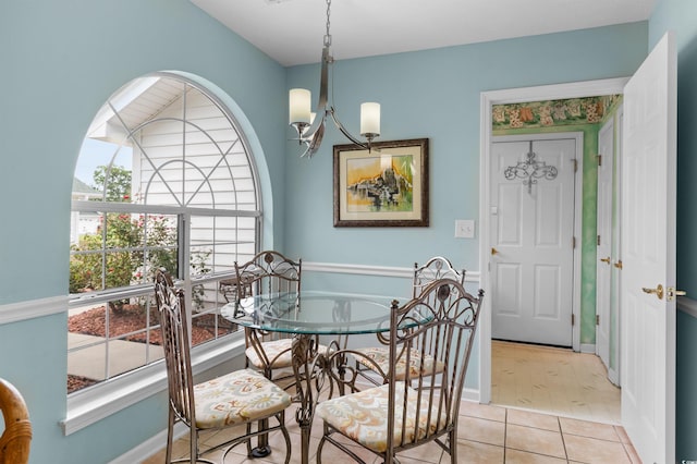 dining room featuring light hardwood / wood-style floors and a chandelier