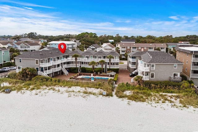 drone / aerial view with a residential view and a water view