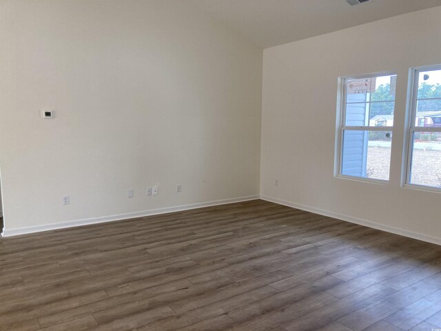 spare room with lofted ceiling